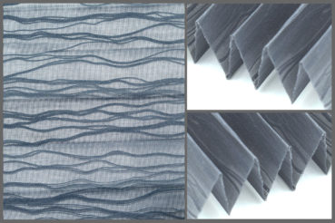 Tkanina plisowana Onda 10425 z nietypowym wzorem i przepuszczającą światło strukturą w kolorze grafitowym.	