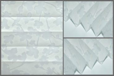 Tkanina Sunshine 820610 w kolorze białym z delikatnym wzorem i firanową strukturą, przepuszczająca światło