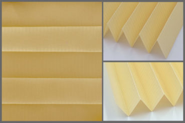 Tkanina plisowana Tosca Pearl 6734 z zaciemniającą strukturą w kolorze żółtym i srebrzystym tyłem odbijającym promienie słoneczne	