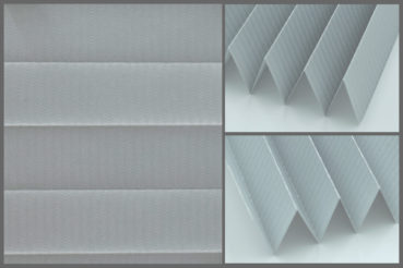 Tkanina plisowana Tosca Pearl 6736 z zaciemniającą strukturą w kolorze szarym i srebrzystym tyłem odbijającym promienie słoneczne	